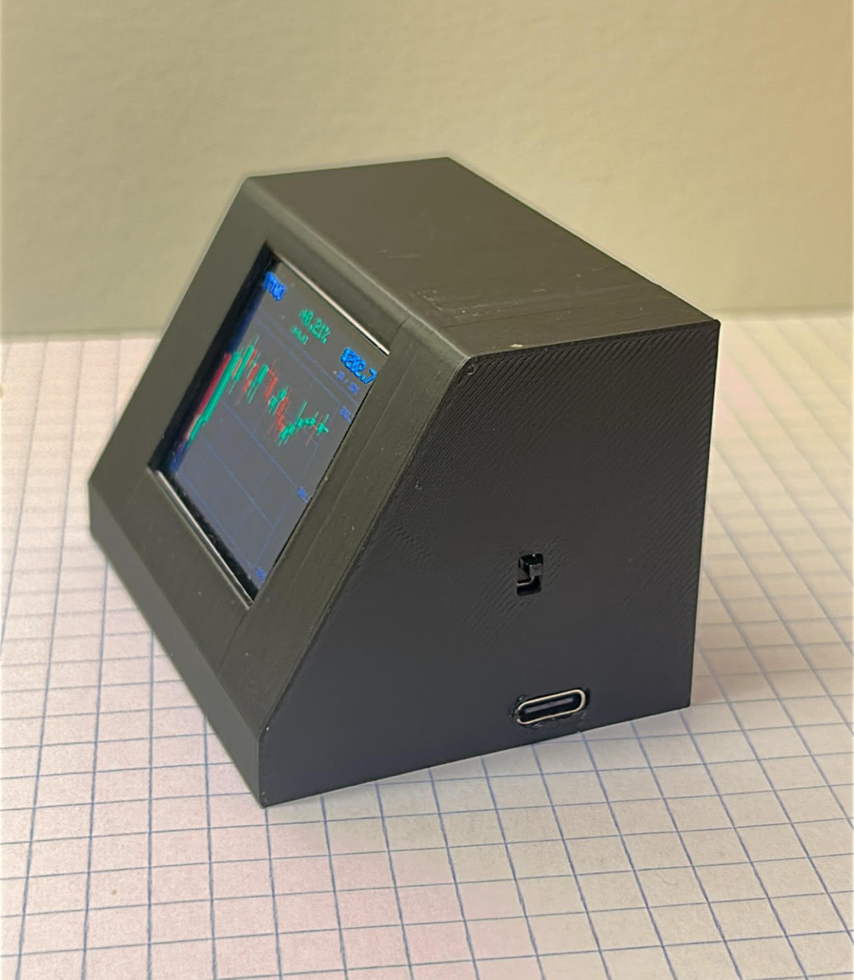 Side view of the finished desk-top stock terminal showing its power switch and USB-C port
